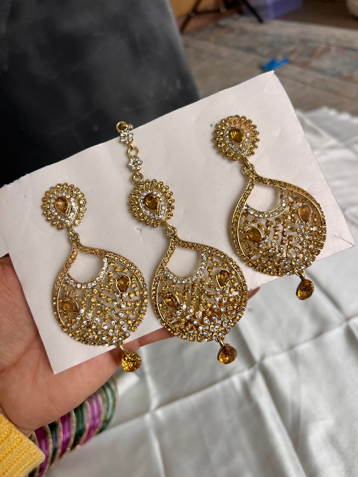 Golden earrings and tikka set