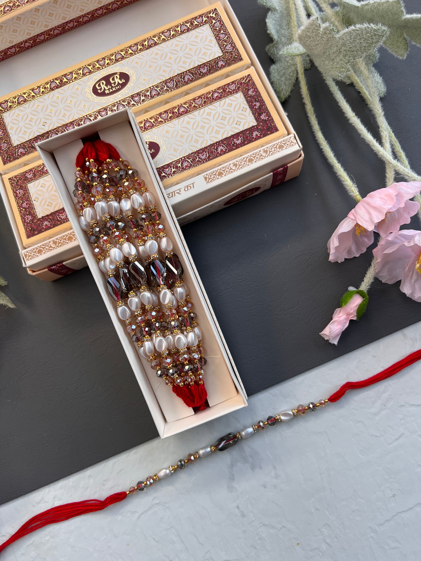 Crystal & Pearl Loaded Rakhi /
Rakhdi Thread ( Per PC)
