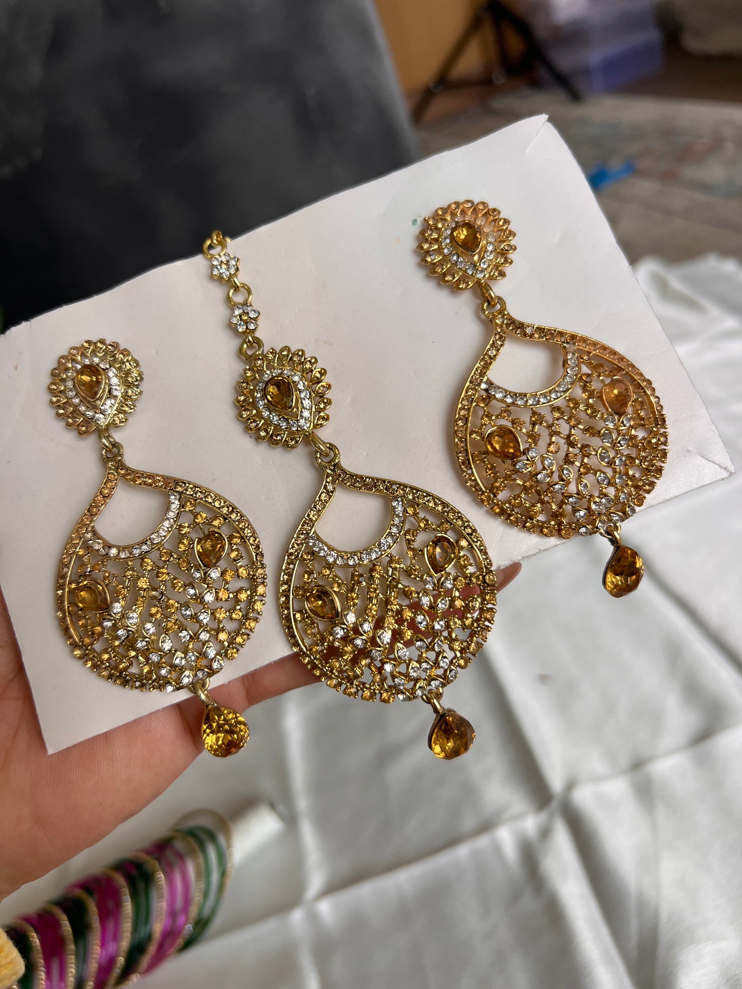 Golden earrings and tikka set