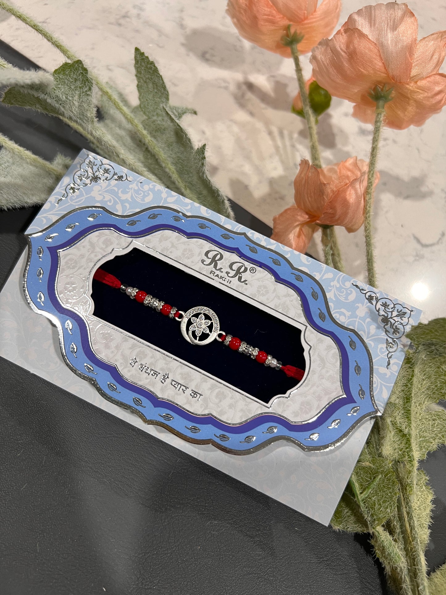Round silver rakhi
