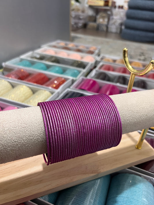 Shimmery hot pink metal bangles