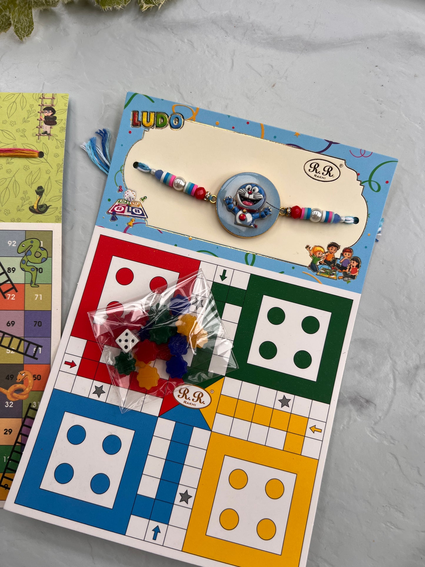 Doremon Game rakhi ( 2 games in one:
Ludo and snack ladder)
Spider man