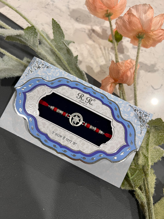 Round silver rakhi