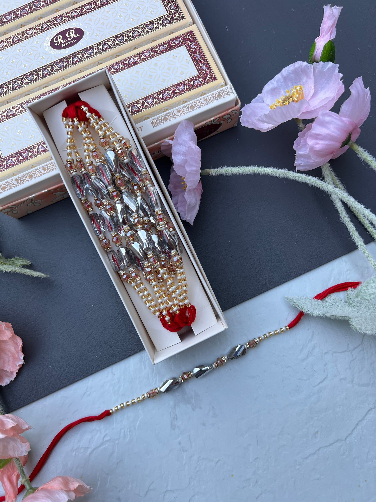 Crystal & Pearl Loaded Rakhi /
Rakhdi Thread ( Per PC)